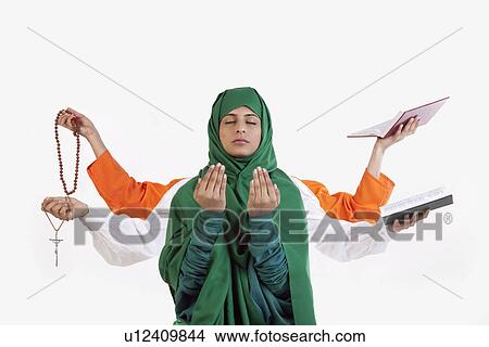 Picture - A Muslim woman praying. Fotosearch