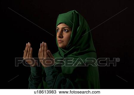 A Muslim woman praying View Large Photo Image Stock Image - A Muslim woman praying. Fotosearch