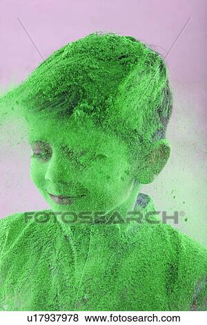 Stock Photo - Boy covered with holi colour. Fotosearch