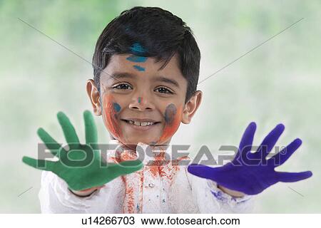 Stock Image - Boy with coloured palms. Fotosearch