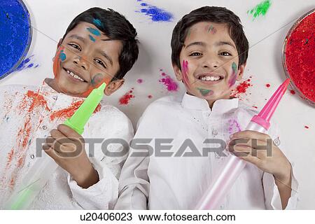 Stock Image - Boys posing with pitchkaris. Fotosearch