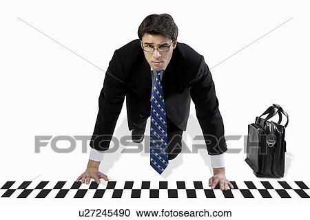 Businessman ready to race View Large Photo Image Stock Image - Businessman ready to race. Fotosearch