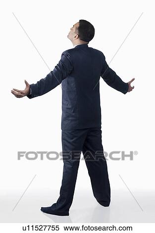 Stock Photography - Businessman standing with arms wide open. Fotosearch