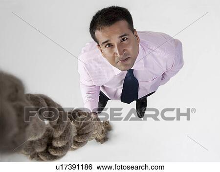 Businessman with rope View Large Photo Image Stock Photograph - Businessman with rope. Fotosearch