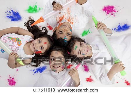 Stock Image - Children posing with pichkaris. Fotosearch