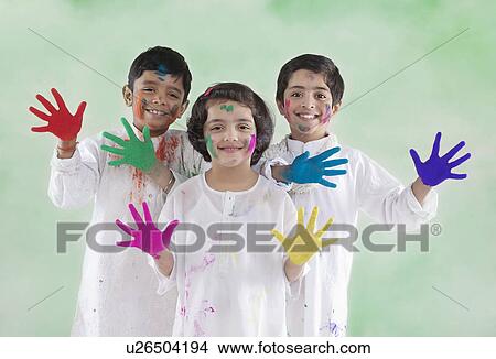 Picture - Children with coloured palms. Fotosearch