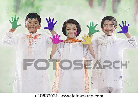 Stock Image - Children with coloured palms. Fotosearch