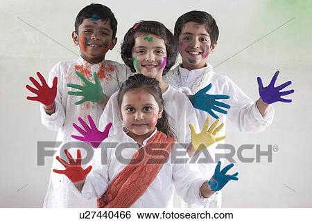 Stock Photograph - Children with coloured palms. Fotosearch