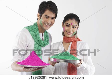 Couple holding a tray of colours View Large Photo Image Stock Image - Couple holding a tray of colours. Fotosearch