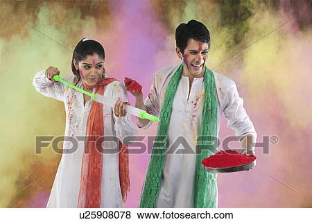 Stock Photo - Couple playing holi. Fotosearch