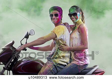 Couple posing on a motorcycle View Large Photo Image Stock Image - Couple posing on a motorcycle. Fotosearch