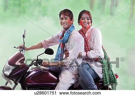 Stock Image - Couple posing on a motorcycle. Fotosearch