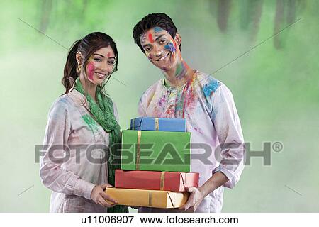Couple with gifts View Large Photo Image Stock Photo - Couple with gifts. Fotosearch