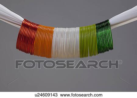 Stock Image - Different coloured bangles. Fotosearch