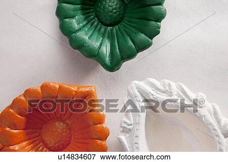 Stock Photo - Different coloured diyas. Fotosearch