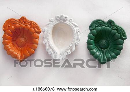 Stock Photo - Different coloured diyas. Fotosearch