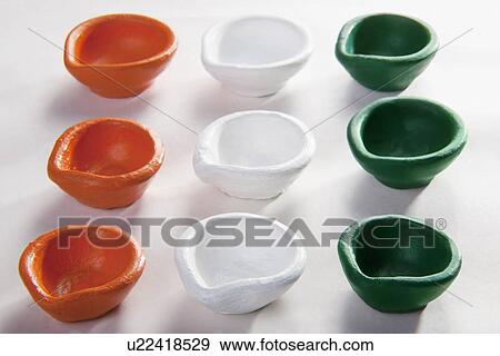 Stock Photo - Different coloured diyas. Fotosearch