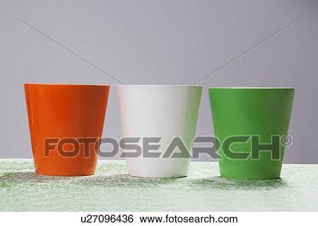 Stock Photograph - Different coloured mugs. Fotosearch
