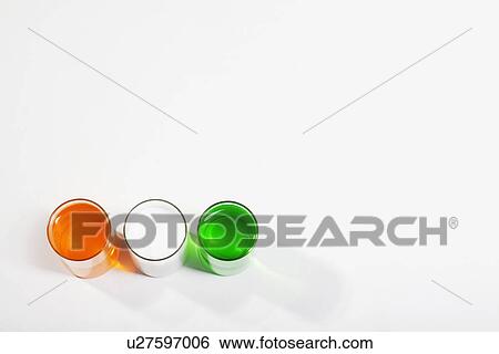 Different coloured paints in a glass View Large Photo Image Stock Photograph - Different coloured paints in a glass. Fotosearch