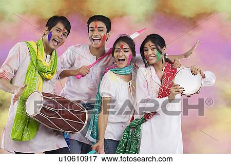 Friends having fun during holi View Large Photo Image Stock Photo - Friends having fun during holi. Fotosearch