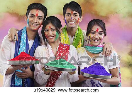 Stock Photo - Friends holding trays with colours. Fotosearch