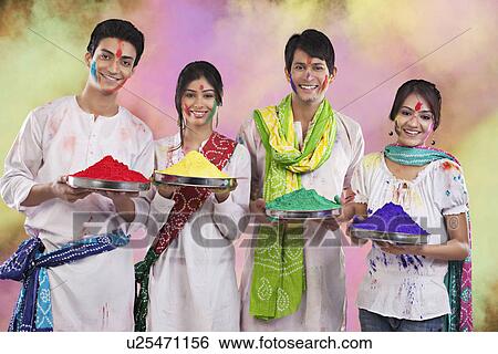 Stock Photograph - Friends holding trays with colours. Fotosearch
