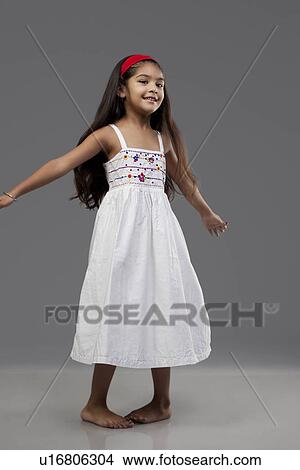 Girl enjoying herself View Large Photo Image Picture - Girl enjoying herself. Fotosearch