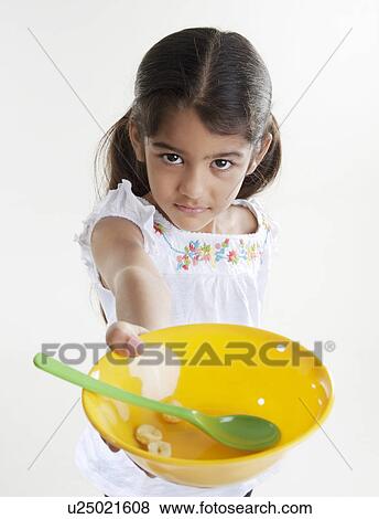 Stock Photo - Girl holding a plastic bowl. Fotosearch