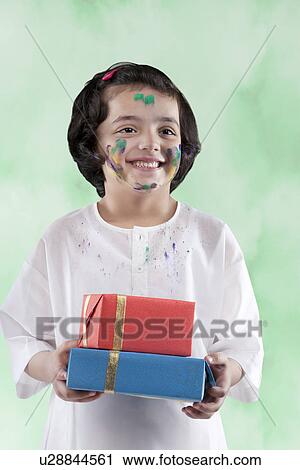 Girl holding gifts View Large Photo Image Stock Image - Girl holding gifts. Fotosearch