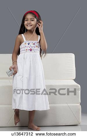 Girl listening to music View Large Photo Image Stock Image - Girl listening to music. Fotosearch