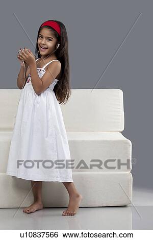 Girl listening to music View Large Photo Image Stock Photograph - Girl listening to music. Fotosearch