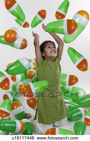 Girl playing with balloons View Large Photo Image Stock Photo - Girl playing with balloons. Fotosearch