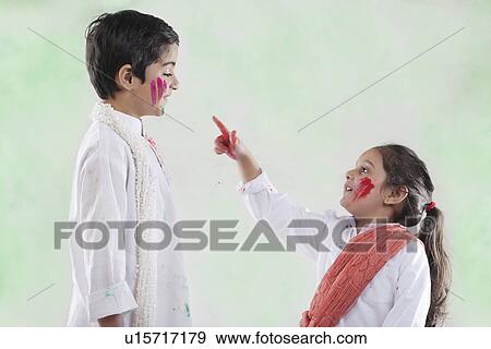 Girl pointing at a boy View Large Photo Image Stock Photo - Girl pointing at a boy. Fotosearch
