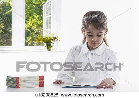 Girl reading a book View Large Photo Image Stock Photography - Girl reading a book. Fotosearch