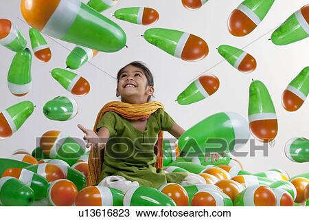Girl sitting with balloons View Large Photo Image Stock Image - Girl sitting with balloons. Fotosearch