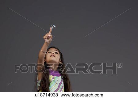 Girl trying to touch a bubble View Large Photo Image Stock Photo - Girl trying to touch a bubble. Fotosearch
