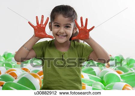 Girl with hands painted red View Large Photo Image Stock Image - Girl with hands painted red. Fotosearch