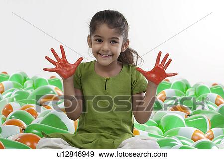 Girl with hands painted red View Large Photo Image Stock Photo - Girl with hands painted red. Fotosearch