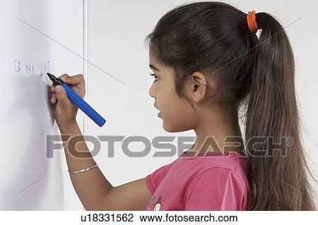 Girl writing on a board View Large Photo Image Stock Image - Girl writing on a board. Fotosearch