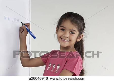 Stock Photograph - Girl writing on a board. Fotosearch
