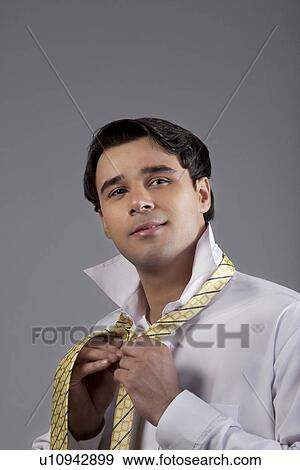 Stock Photo - Man getting ready for office. Fotosearch