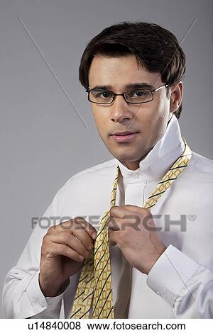 Stock Photo - Man getting ready for office. Fotosearch