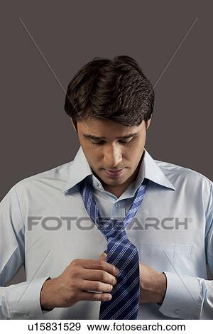 Man getting ready for office View Large Photo Image Stock Photo - Man getting ready for office. Fotosearch