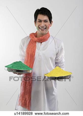 Man holding trays with colours View Large Photo Image Stock Photo - Man holding trays with colours. Fotosearch
