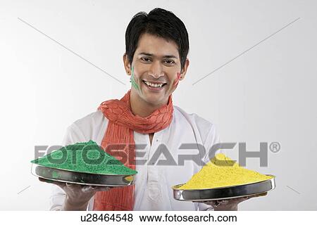 Man holding trays with colours View Large Photo Image Stock Photo - Man holding trays with colours. Fotosearch