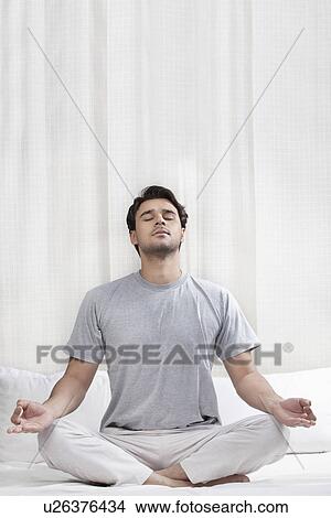 Man meditating View Large Photo Image Picture - Man meditating. Fotosearch