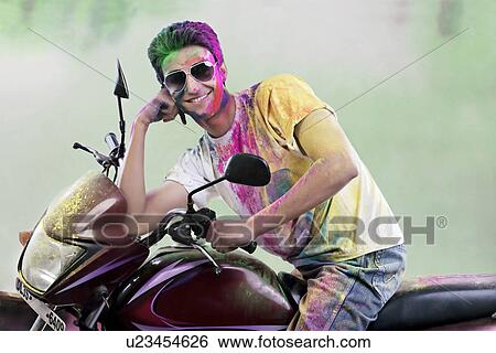 Man posing on a motorcycle View Large Photo Image Stock Photograph - Man posing on a motorcycle. Fotosearch
