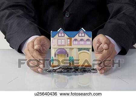 Man protecting his savings View Large Photo Image Stock Photograph - Man protecting his savings. Fotosearch