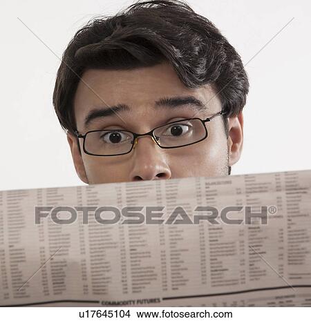 Picture - Man reading a newspaper. Fotosearch