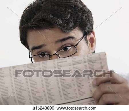 Stock Image - Man reading a newspaper. Fotosearch